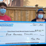 New team member presents Many Happy Returns donations