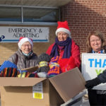 Knatty Knitters present handmade blankets for people in hospital over Christmas